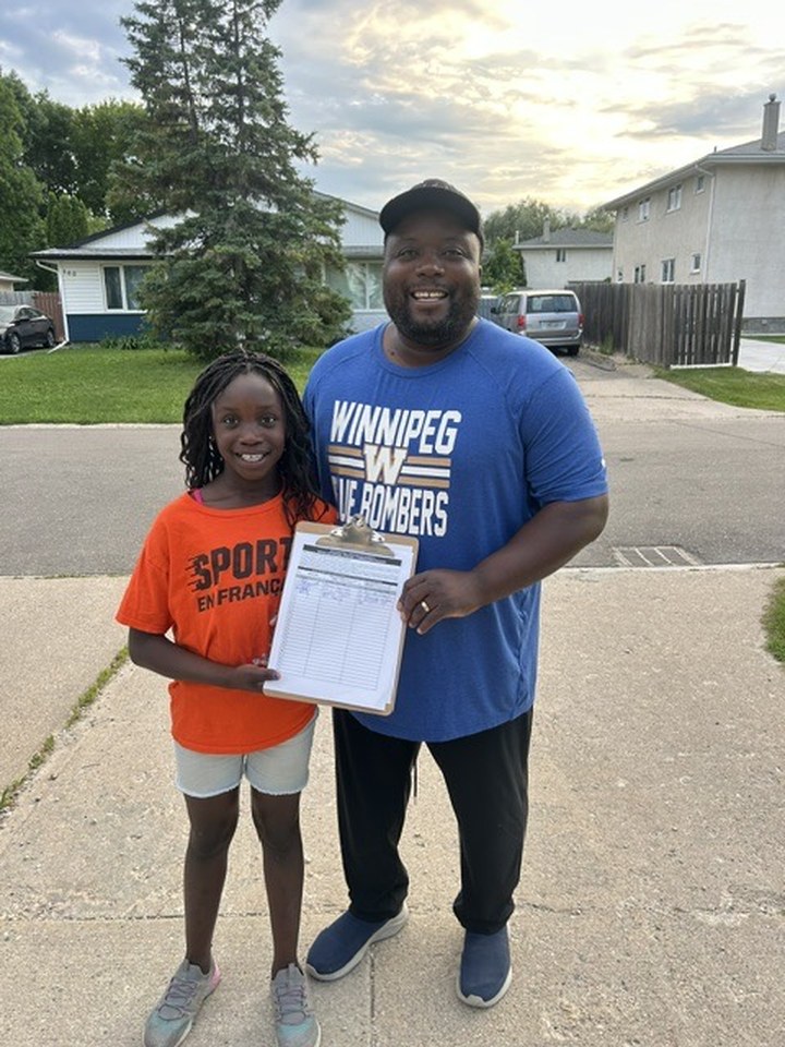 Chipalo Simunyola and his daughter out on the doors in Ward 4
